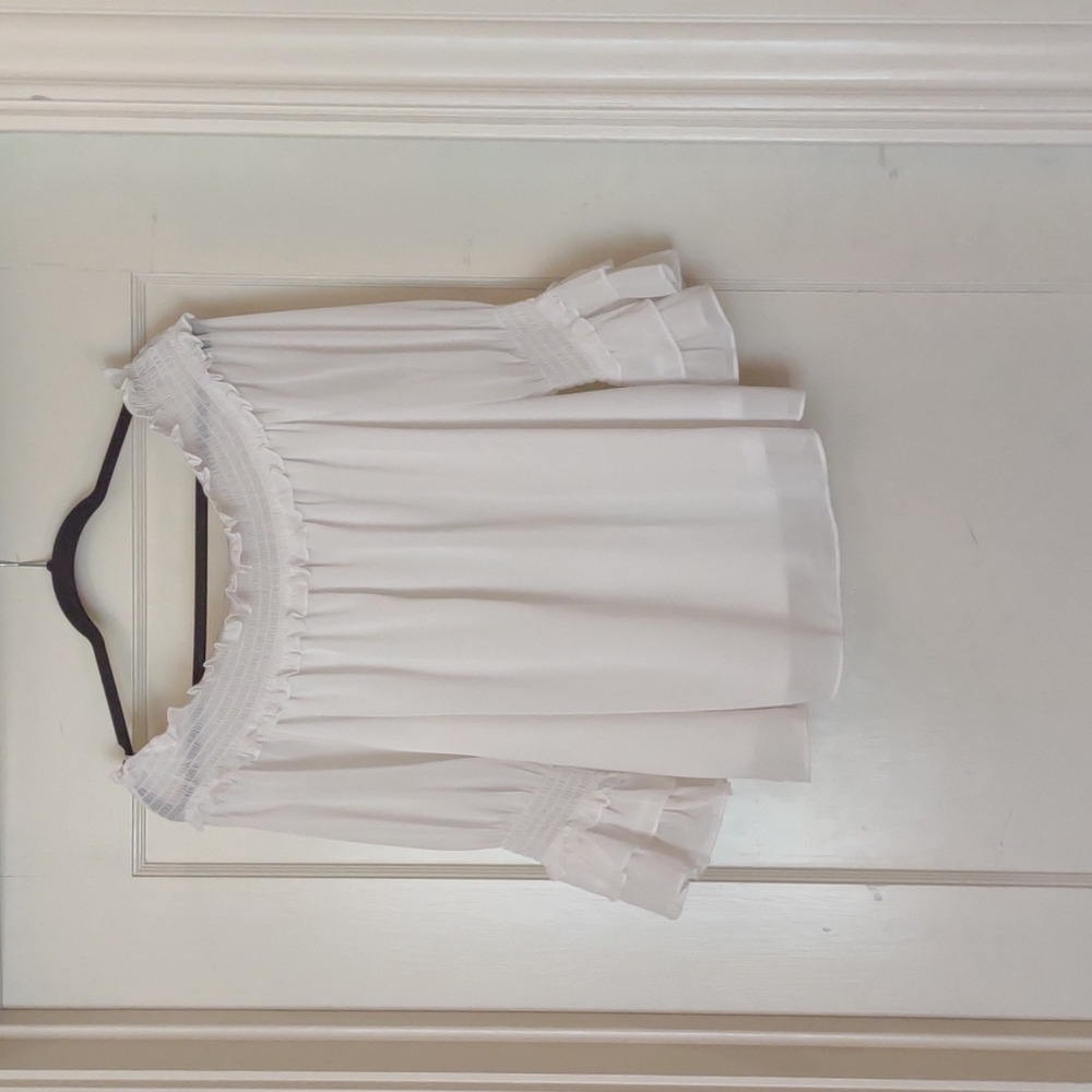 Large, White, off the shoulder top.